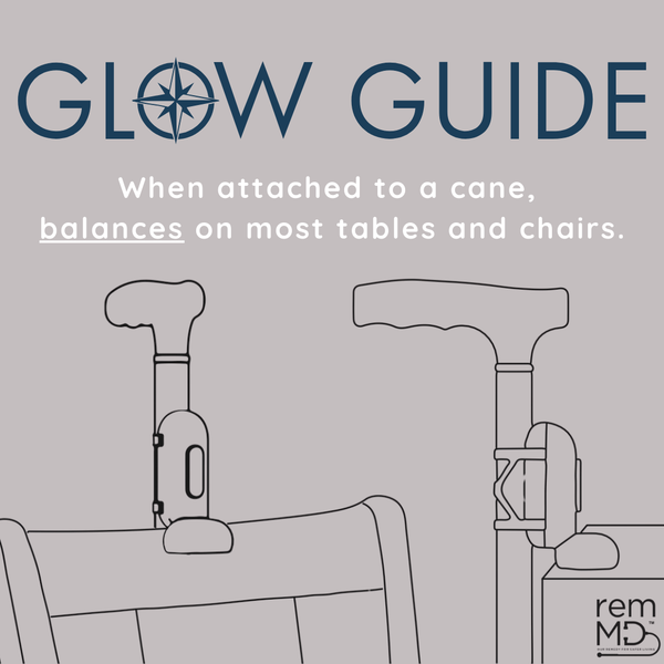 Illustration of a cane with a 'Glow Guide' feature attached, balancing on a chair.