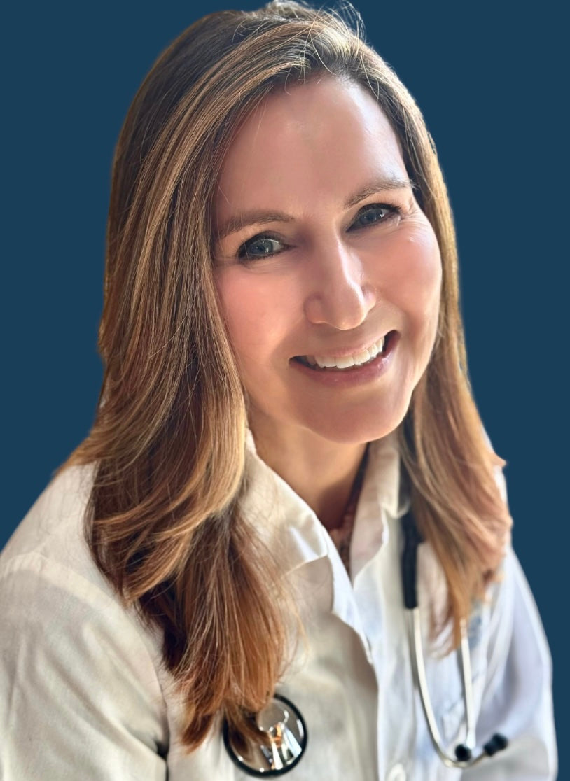 Dr. Susan smiling wearing white lab coat and stethoscope.